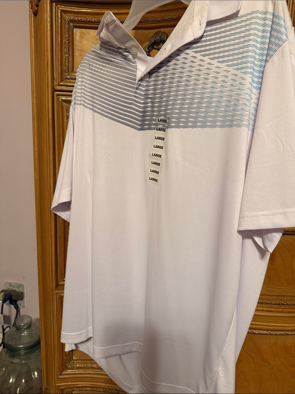 Callaway White Polo with Light Blue Geometric Chest Pattern